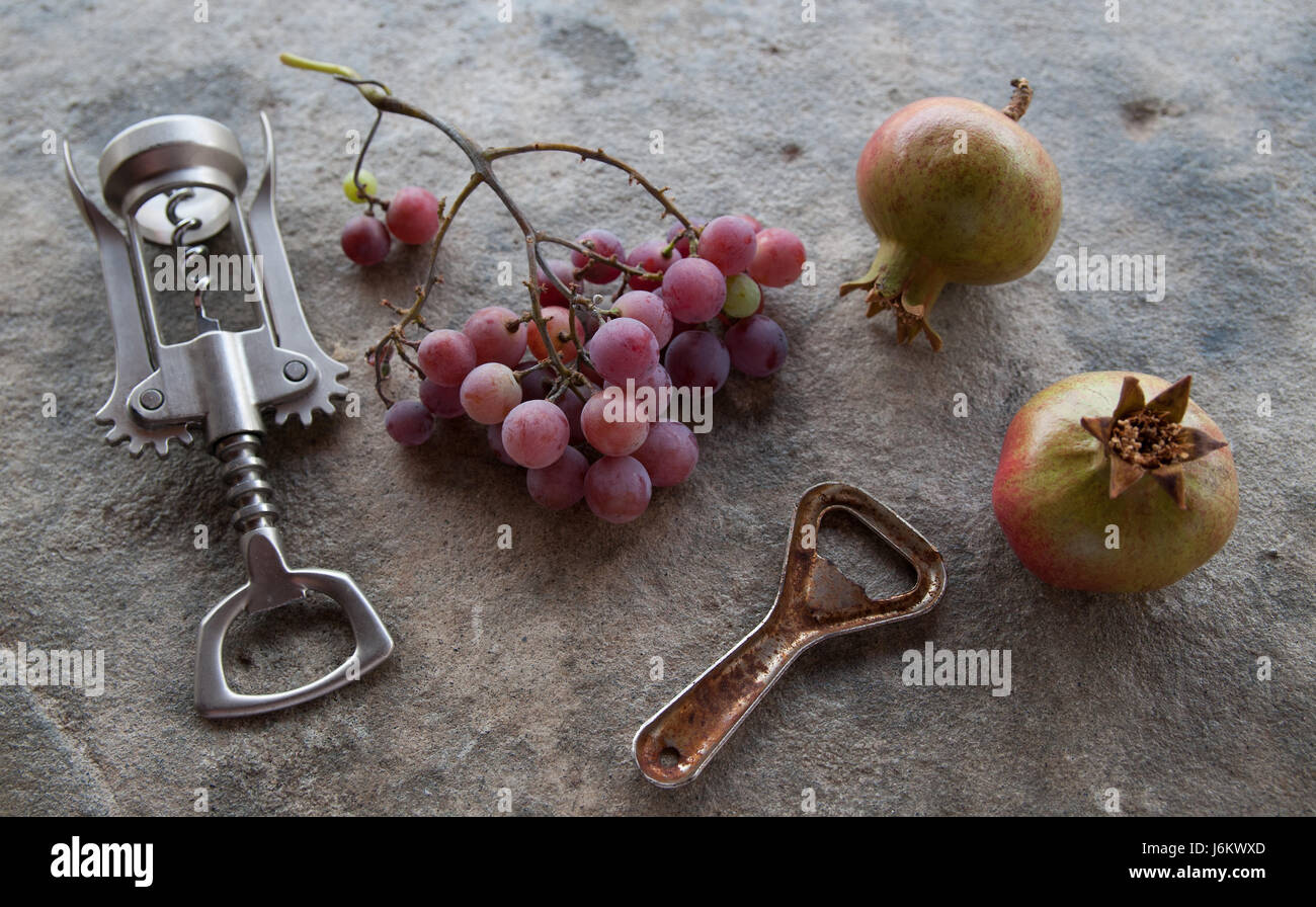 Top view pomegranate wine, bottle opener and fruit Stock Photo - Alamy
