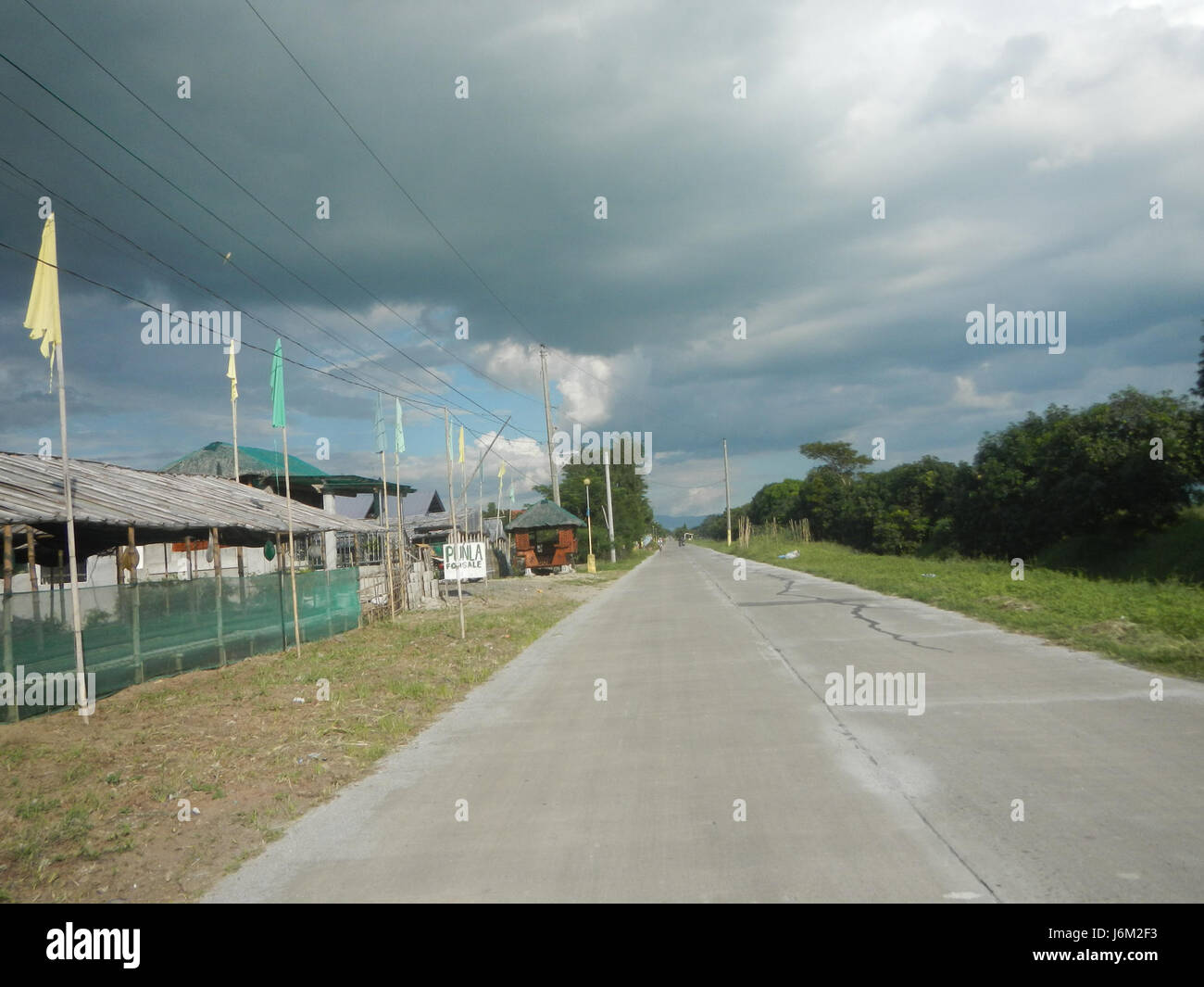This image depicts the rural landscape of Magumbali, Candaba, Pampanga ...