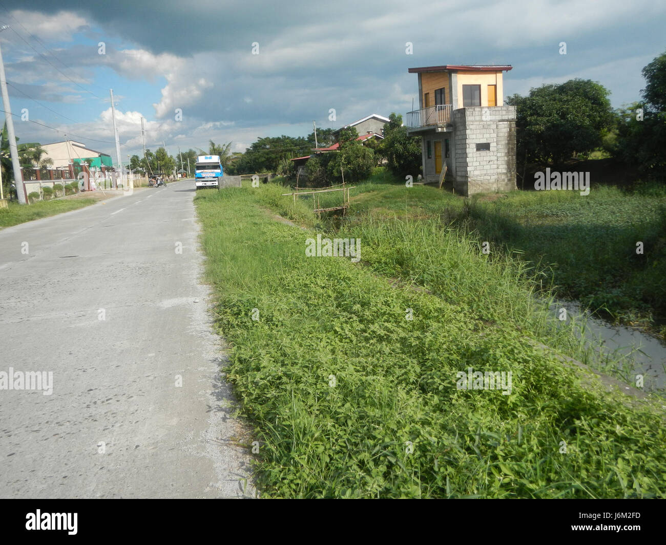 This image shows the rural landscape of Magumbali, Candaba, Pampanga ...
