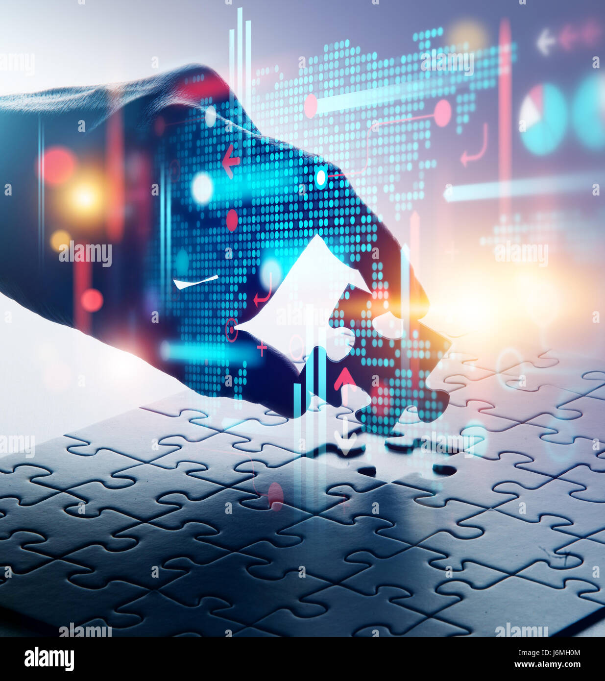 Hand putting down the last piece of jigsaw puzzle. Data solution