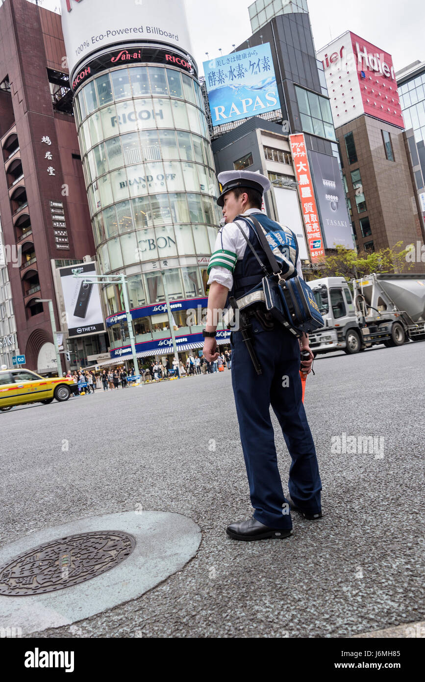 Japanese policeman on traffic control. Stock Photo