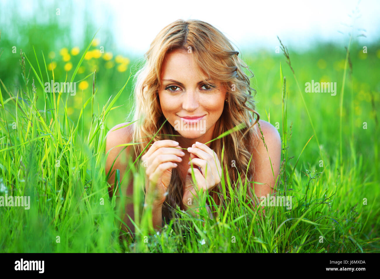 woman on the green grass happy and smile Stock Photo - Alamy