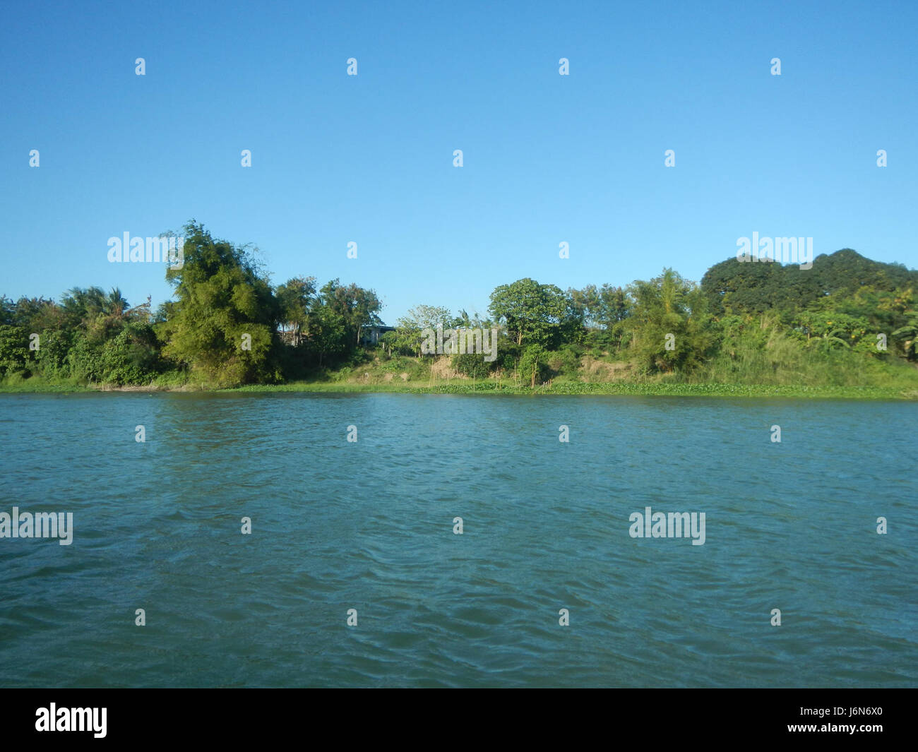 This image shows the construction of riprap along the riverbanks in ...