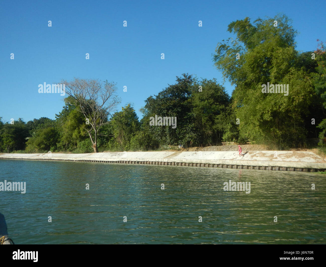 This image shows the riprap construction along the riverbanks in ...