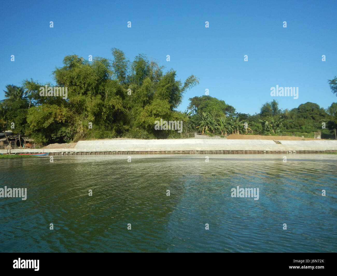 The project involves the construction of a riprap along the riverbanks ...