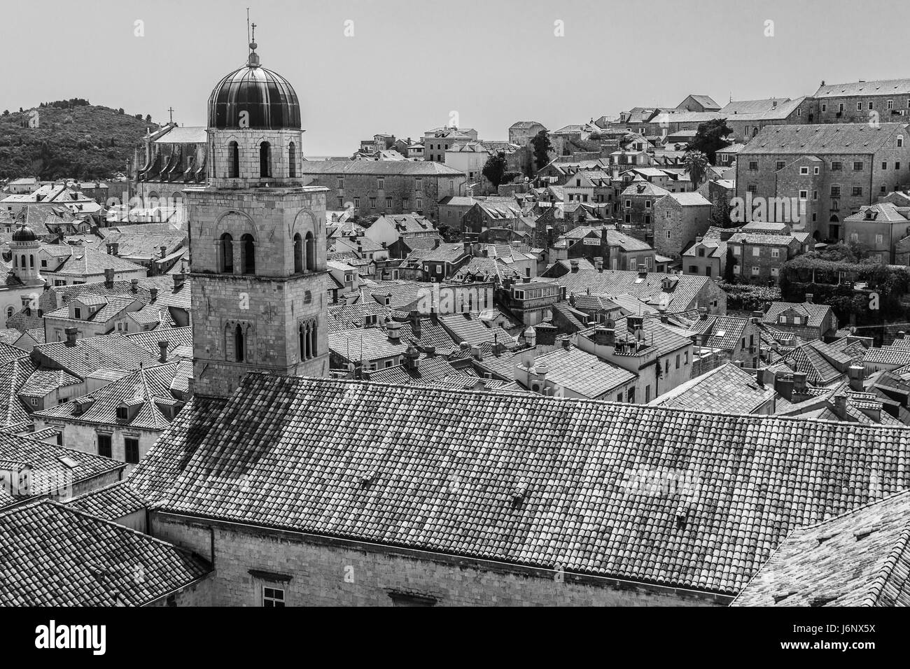 A monochrome image of the Franciscan Church and Monastery in the old town of Dubrovnik - captured at the start of the 2017 holiday season in the South Stock Photo