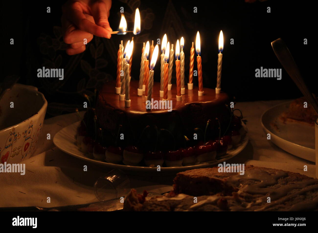 Birthday cake with candles lit hi-res stock photography and images - Alamy