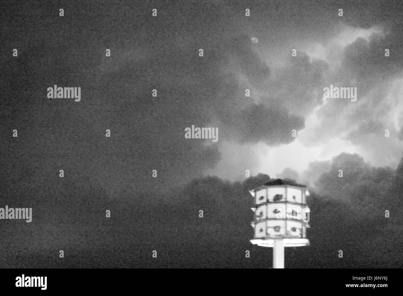 Birdhouse in the middle of a storm. Stock Photo