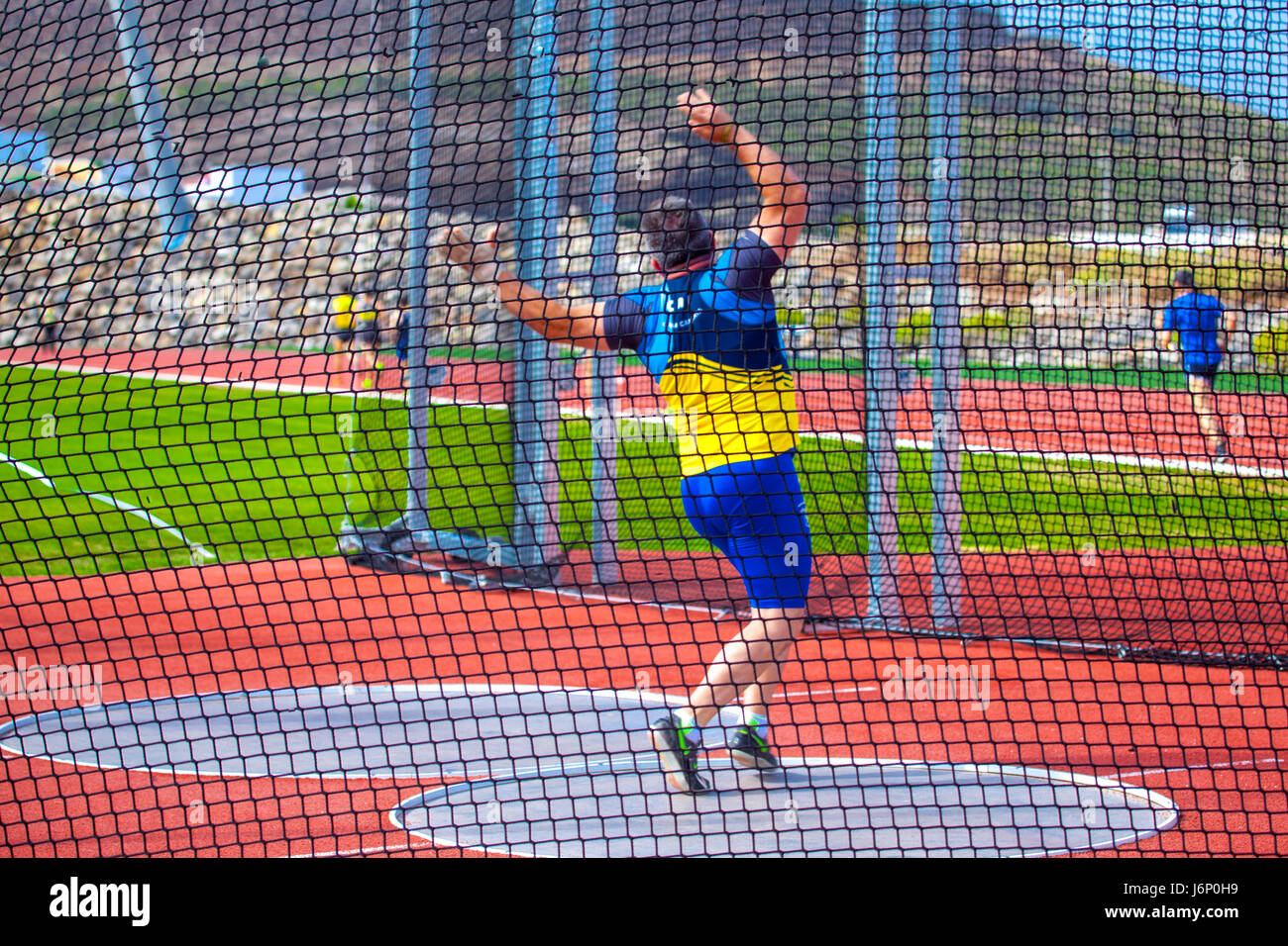 middleaged man throwing the hammer inside a net cage in the CIAT Tenerife Stock Photo Alamy