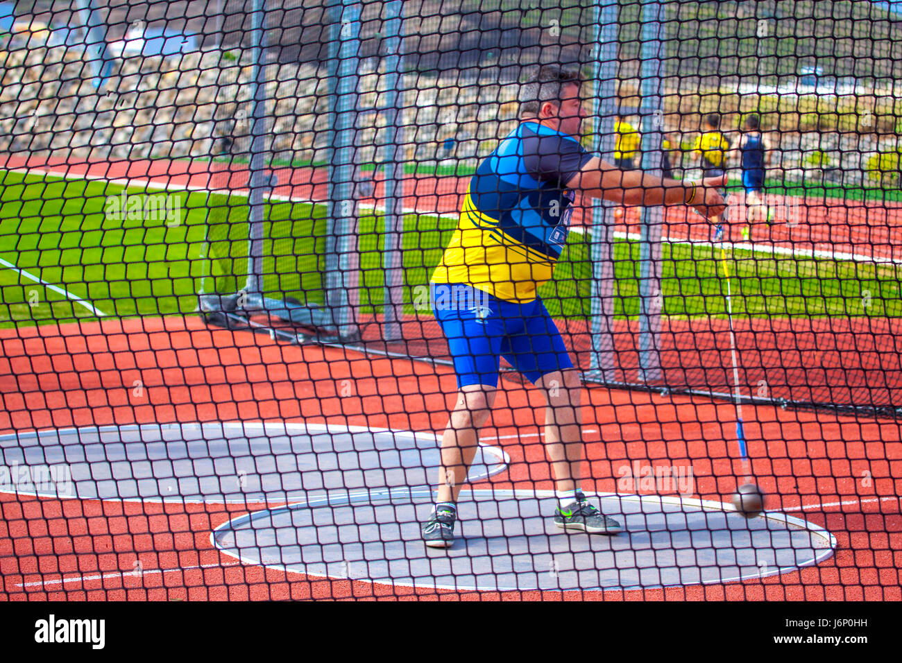 middleaged man throwing the hammer inside a net cage in the CIAT Tenerife Stock Photo Alamy