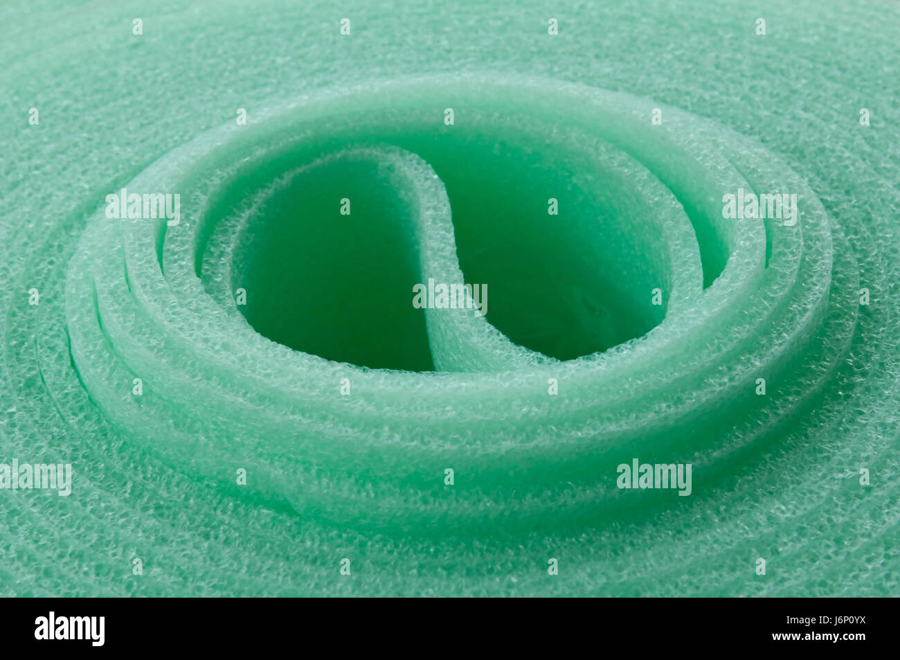 green plastic synthetic material repress green plastic synthetic material roll Stock Photo