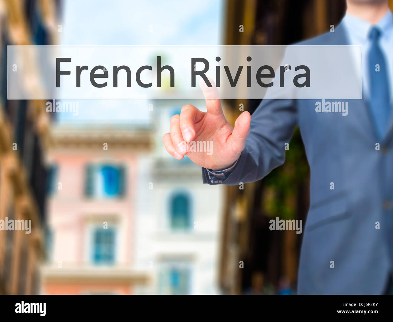French Riviera - Businessman hand pressing button on touch screen interface. Business, technology, internet concept. Stock Photo Stock Photo