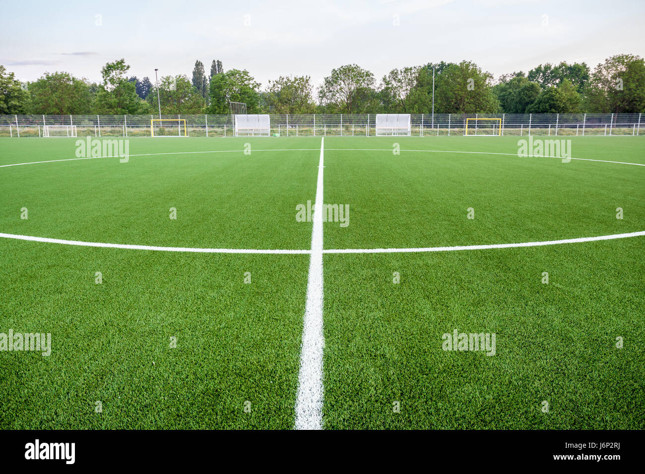 An football field with artificial turf and white lines Stock Photo