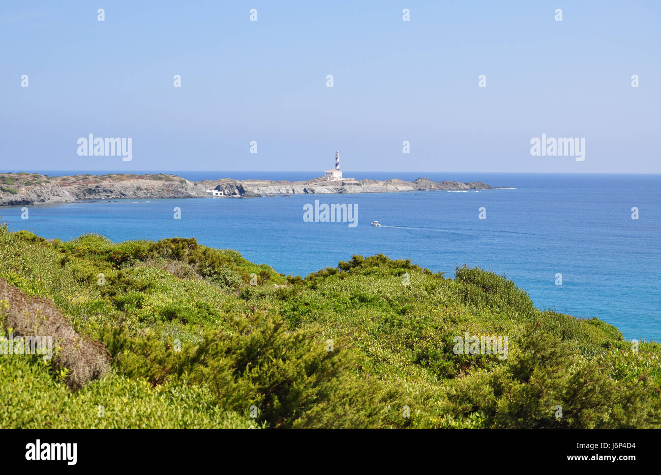 Tortuga beach, harbor and lighthouse view on Menorca Balearic island in Spain Stock Photo