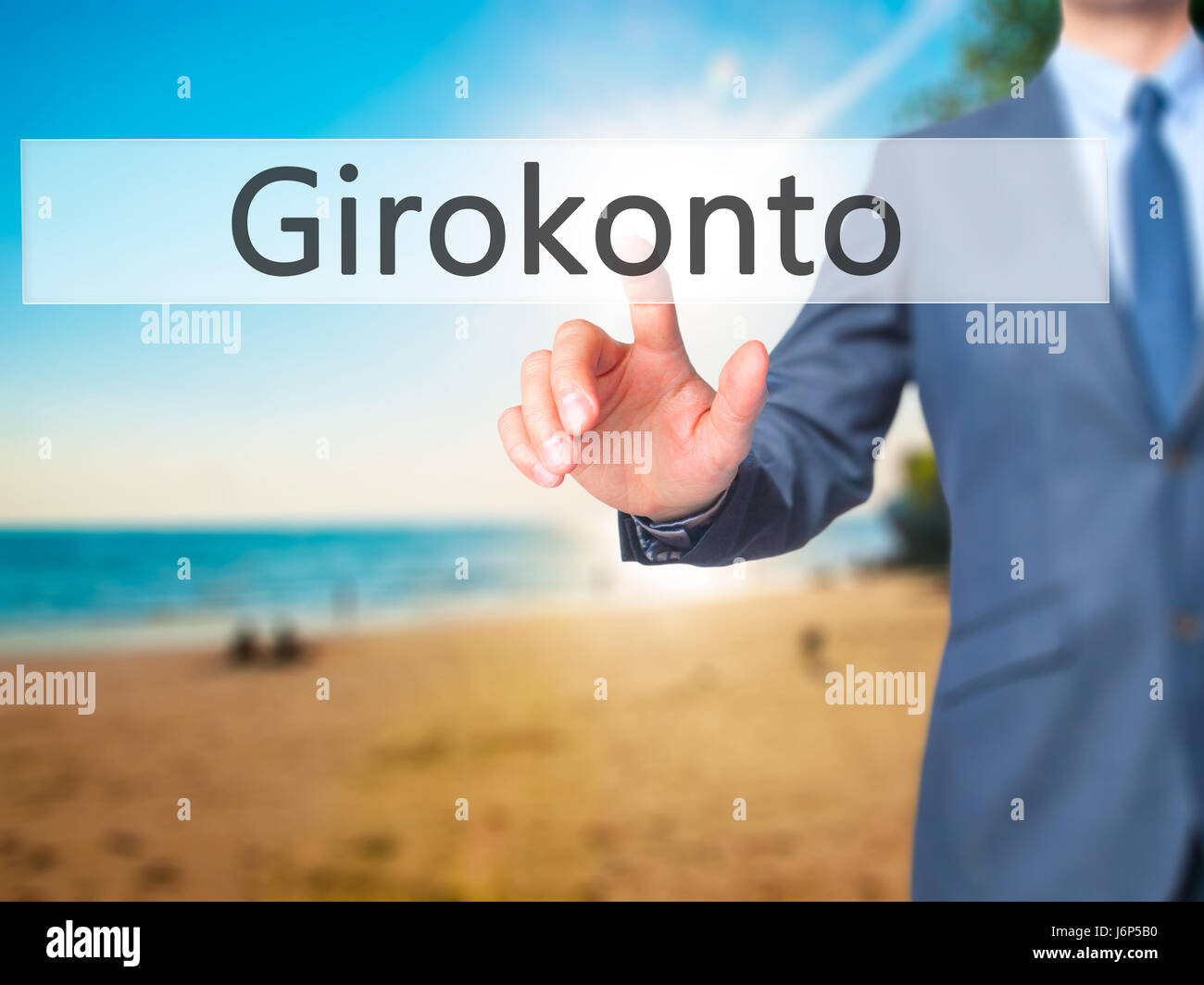 Girokonto (Checking Account) - Businessman hand pressing button on touch screen interface. Business, technology, internet concept. Stock Photo Stock Photo
