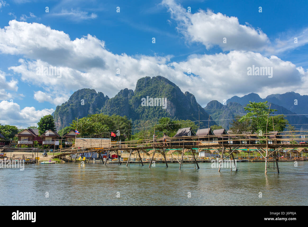 Wooden bridge across Nam Song river at Vang Vieng, Laos Stock Photo