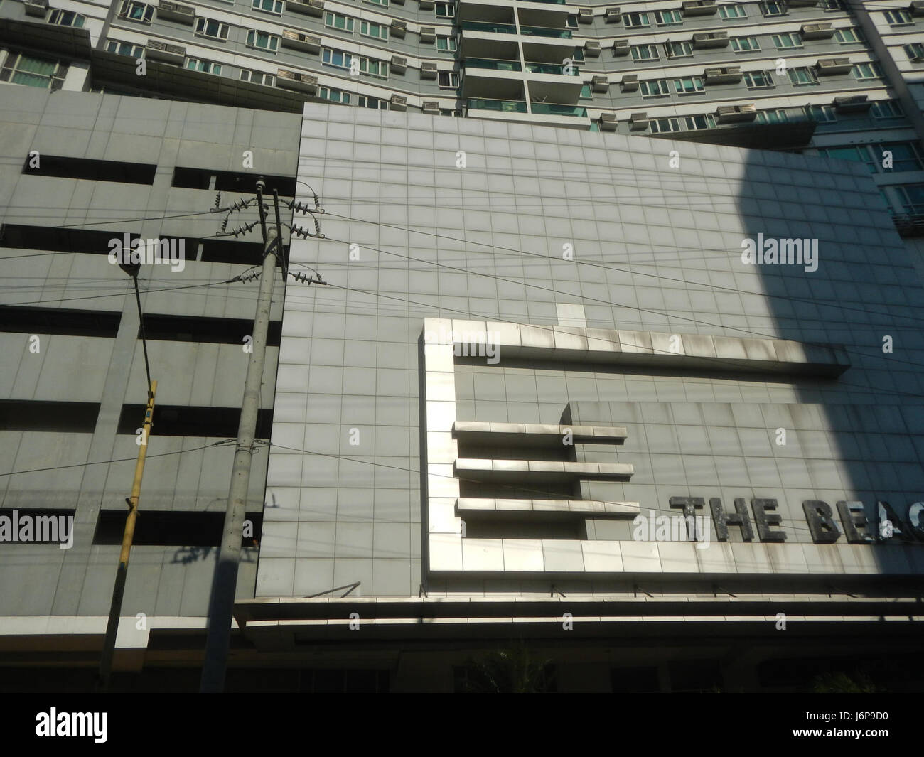This image features The Beacon Roces Tower, a prominent building ...