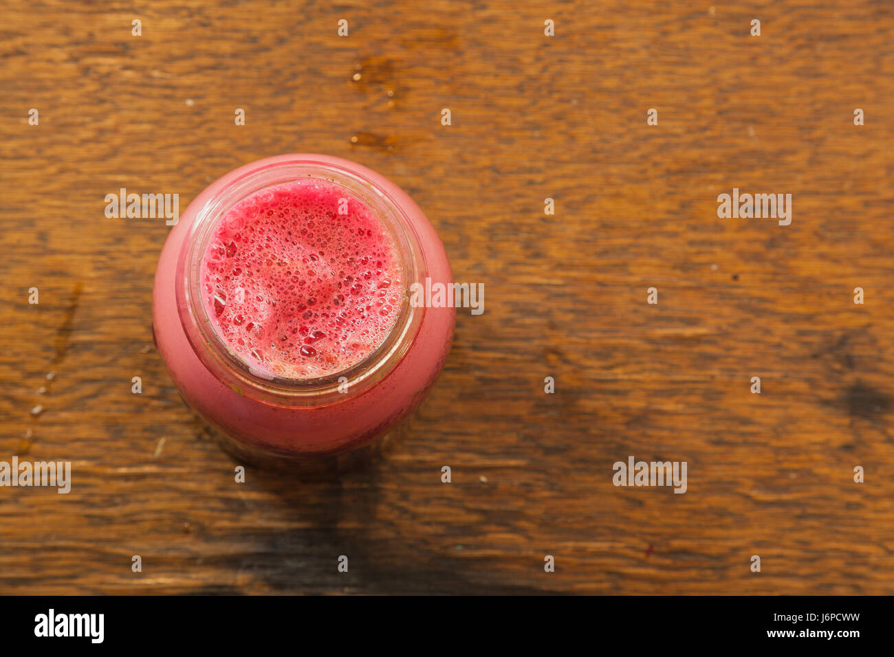 A Ball jar full of fresh beet juice Stock Photo