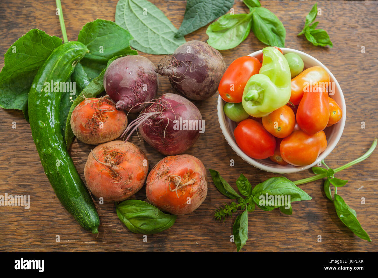 Assorted raw vegetables on a wooden table Stock Photo