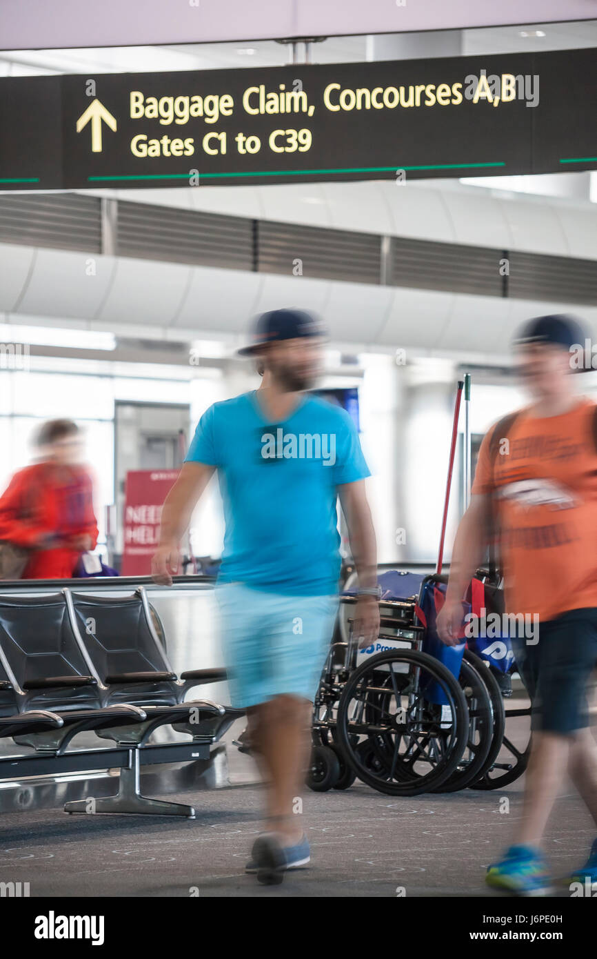 Passengers hustle between terminals at Denver Airport Stock Photo Alamy