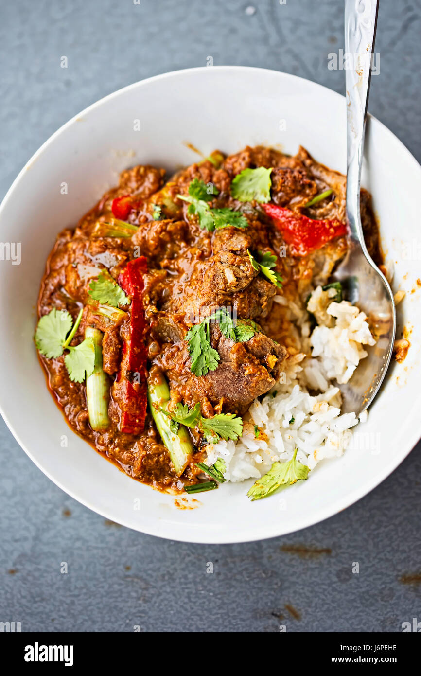 Malaysian beef curry with scallions and red peppers Stock Photo Alamy