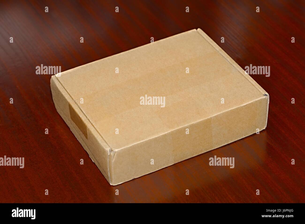 Open cardboard box on a desk Stock Photo