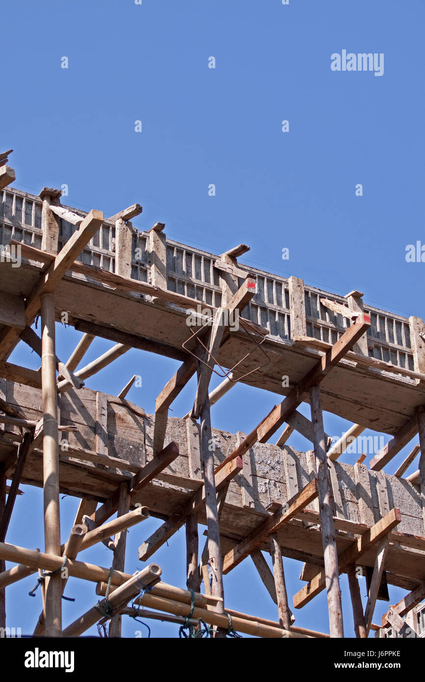 scaffold scaffolding construction site wood new building statics building Stock Photo