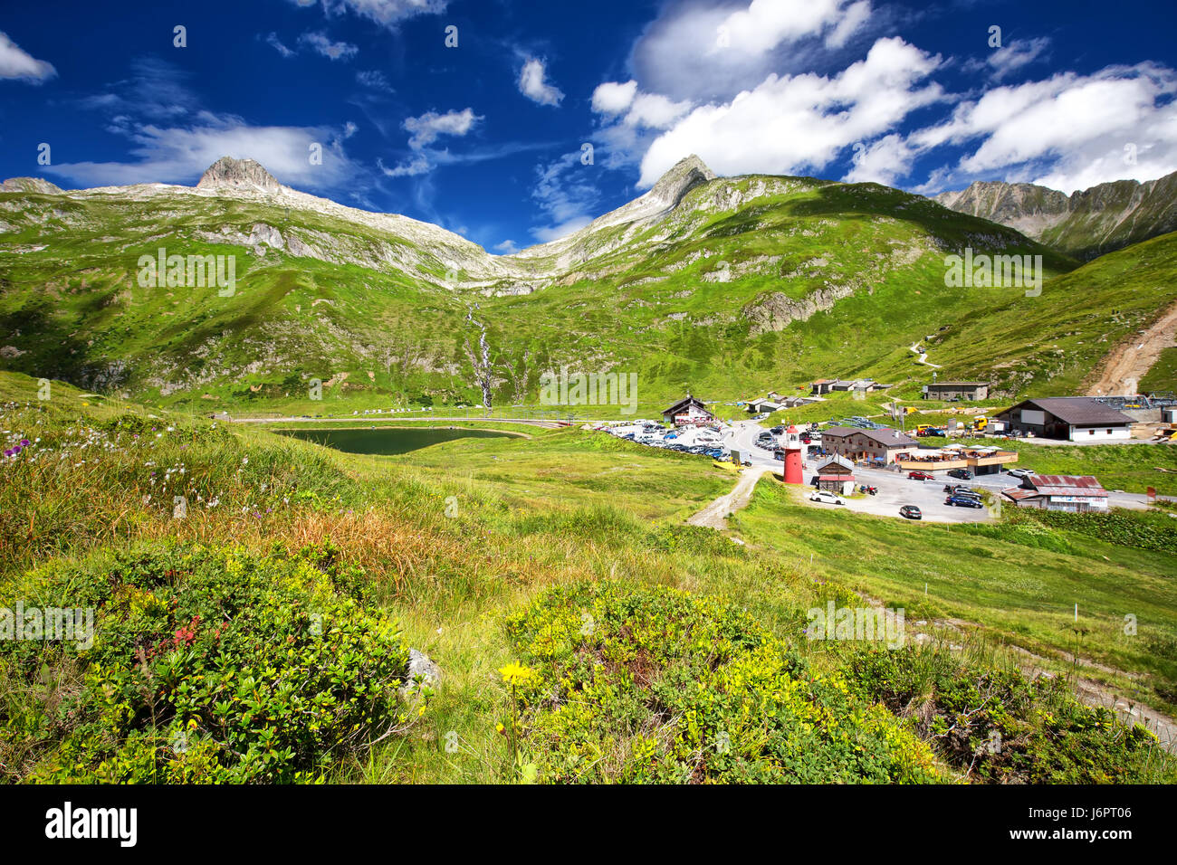 Top of the Oberalpass surrounded by waterfall, Oberalpsee and Swiss Alps, Switzerland. Stock Photo