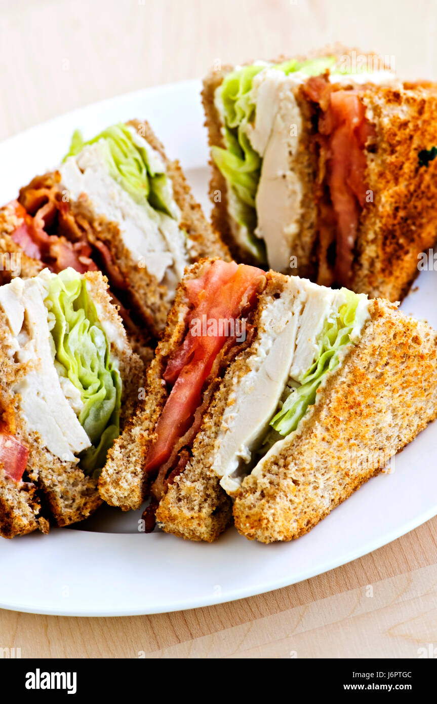 chicken sandwich association club lettuce sliced bacon food aliment bread hot Stock Photo