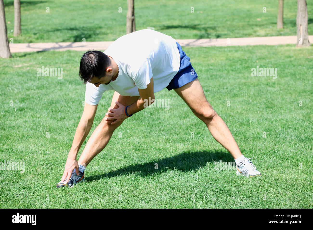 Active person stretching body muscles hi-res stock photography and ...