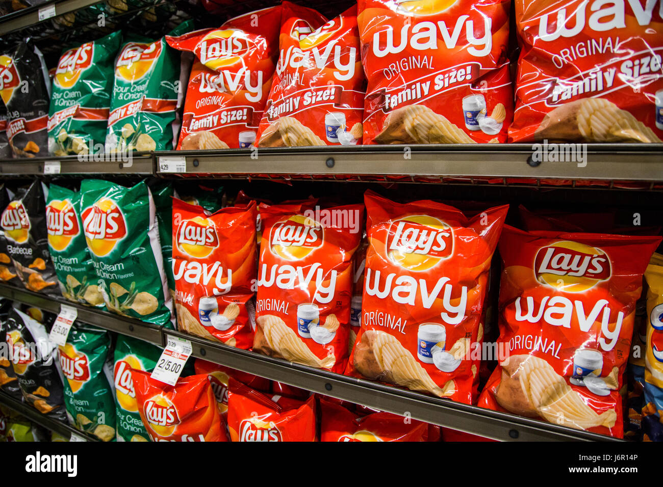 grocery store shelves with bags of Lays potato chips Stock Photo