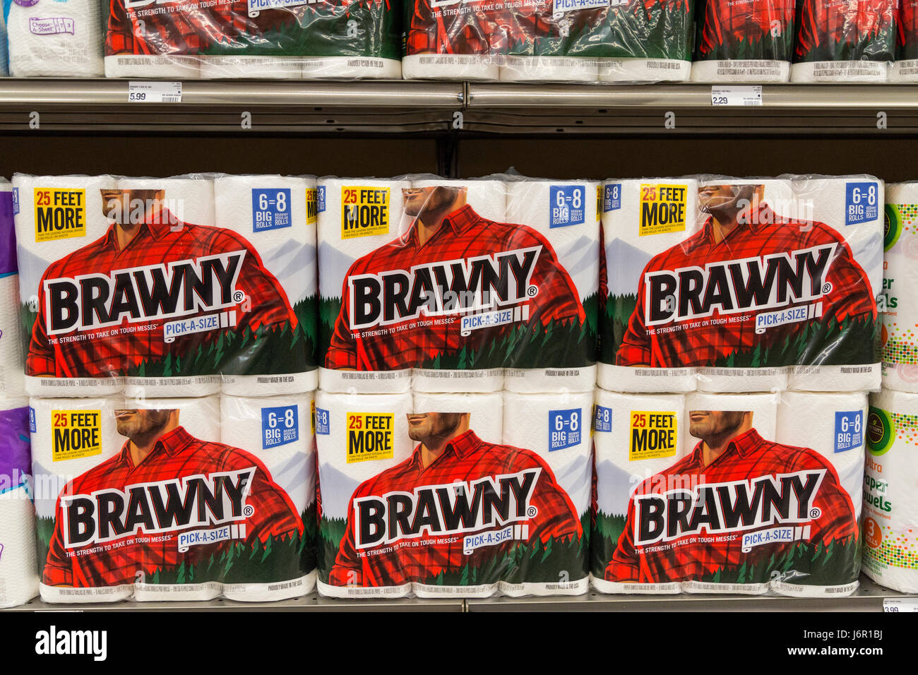 packages of Brawny brand paper towels stacked on grocery store shelves Stock Photo