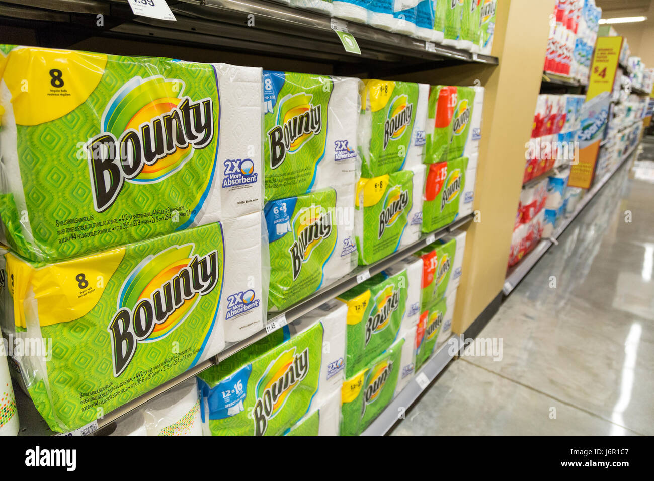packages of Bounty brand paper towels stacked on grocery store shelves Stock Photo