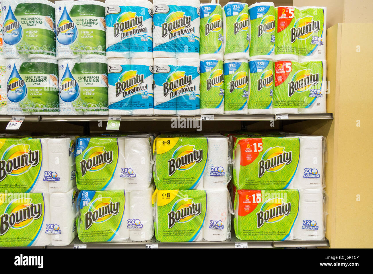 packages of Bounty brand paper towels stacked on grocery store shelves Stock Photo