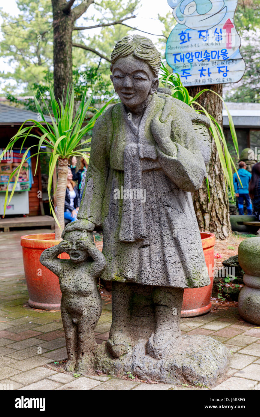 Haenyeo statue of a Korean female diver with child in Jeju island