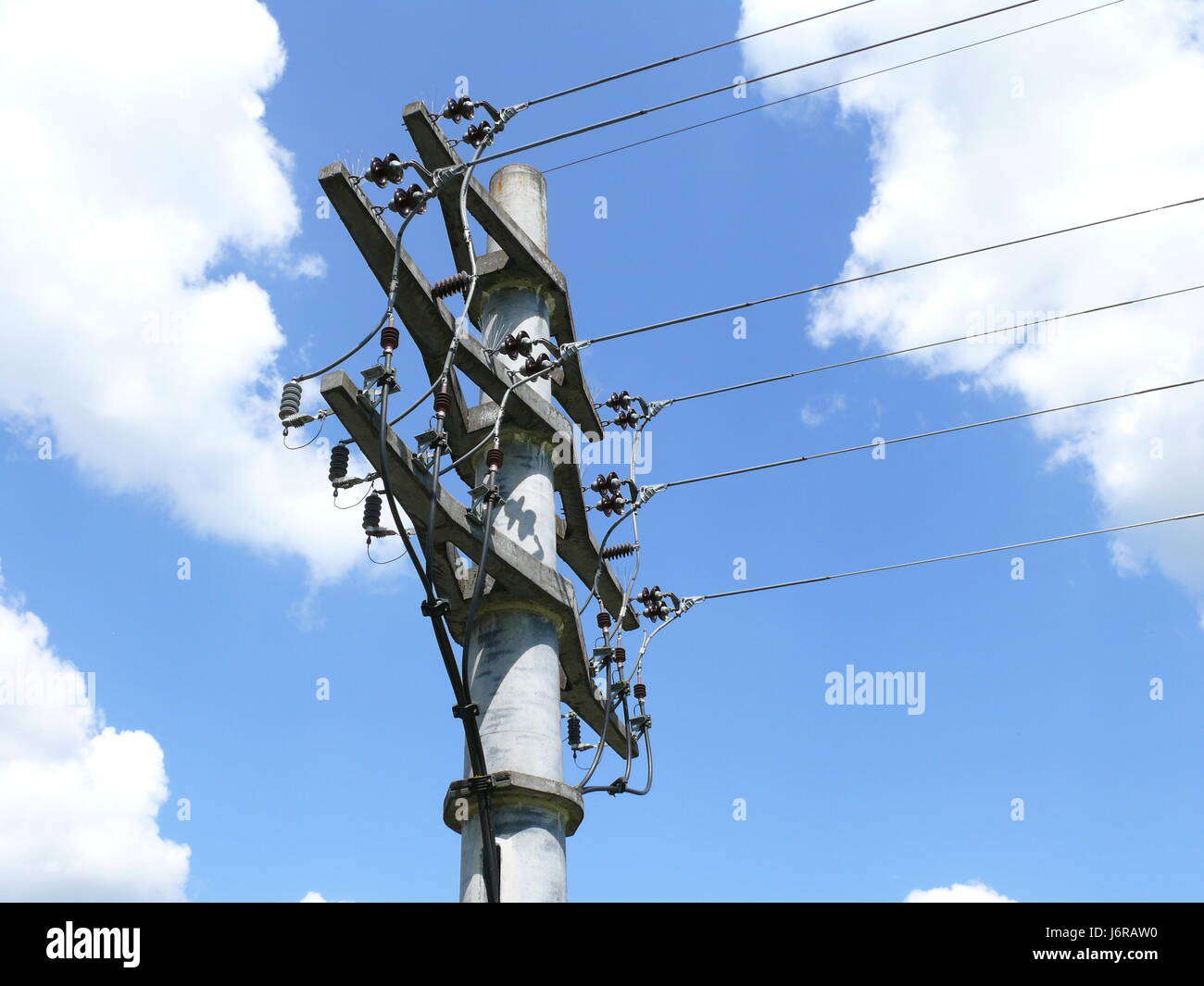 mast current mast high-tension line open-wire pole blue energy power Stock Photo