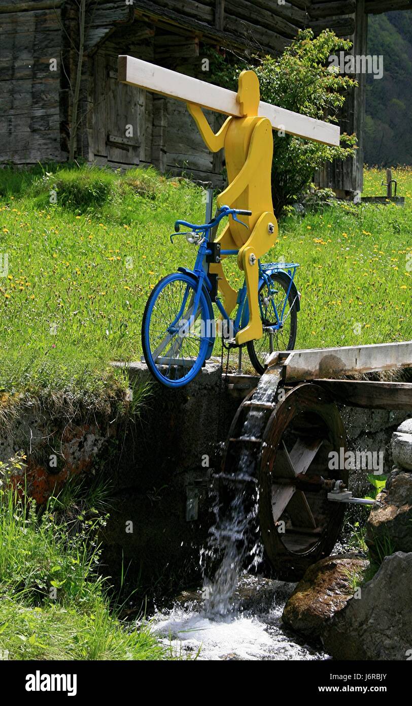 witty water wheel waterpower bikrider driven on bike bicycle cycle photo model Stock Photo