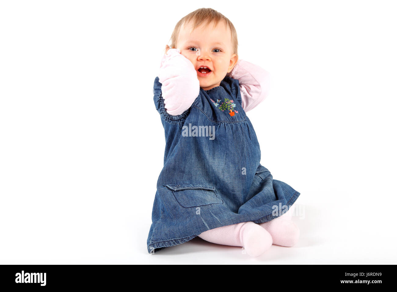 skirt hand hands jeans trousers jean trousers baby put sitting sit toddler  Stock Photo - Alamy