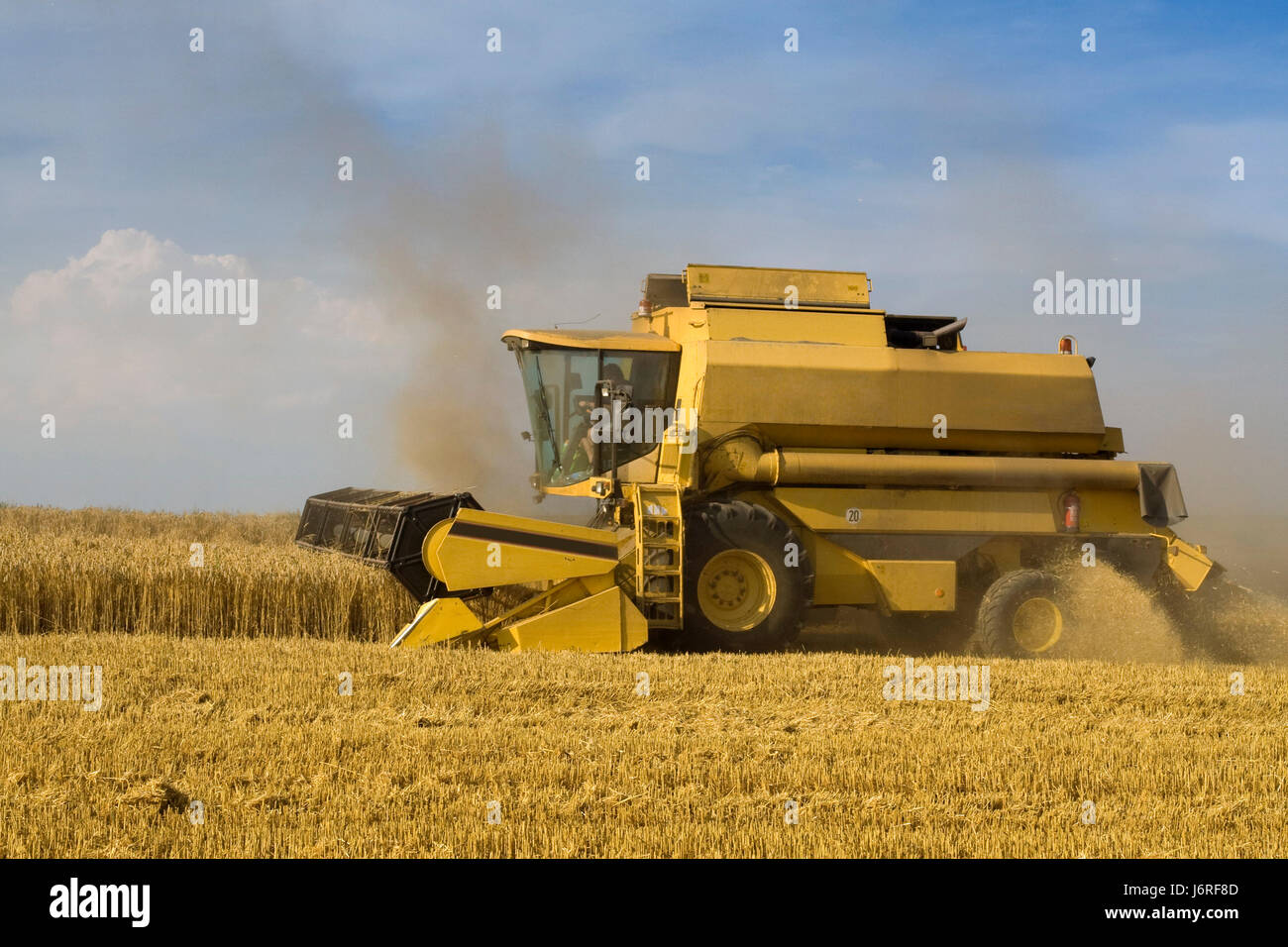 agriculture farming cereal harvester harvesting grain combine railway Stock Photo