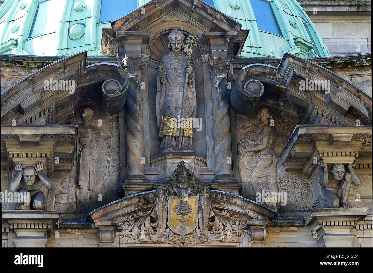 GLASGOW, SCOTLAND - 3 MAY 2017: St Mungo and the coat of arms of the city of Glasgow adorn the entrance to the former Glasgow Savings Bank Stock Photo