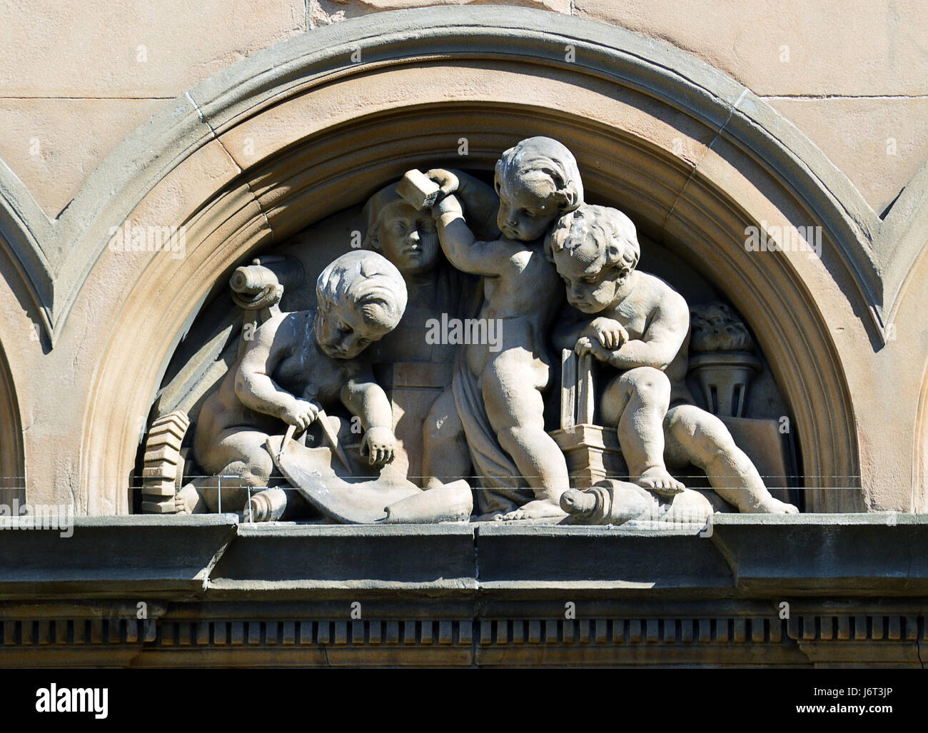 Putti planning and executing a building project, sculptures atop an