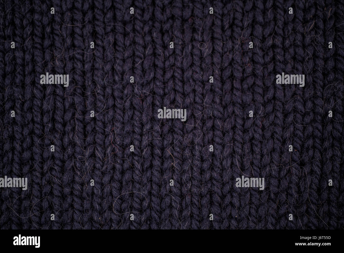 Texture of dark blue knitted woolen fabric closeup Stock Photo Alamy