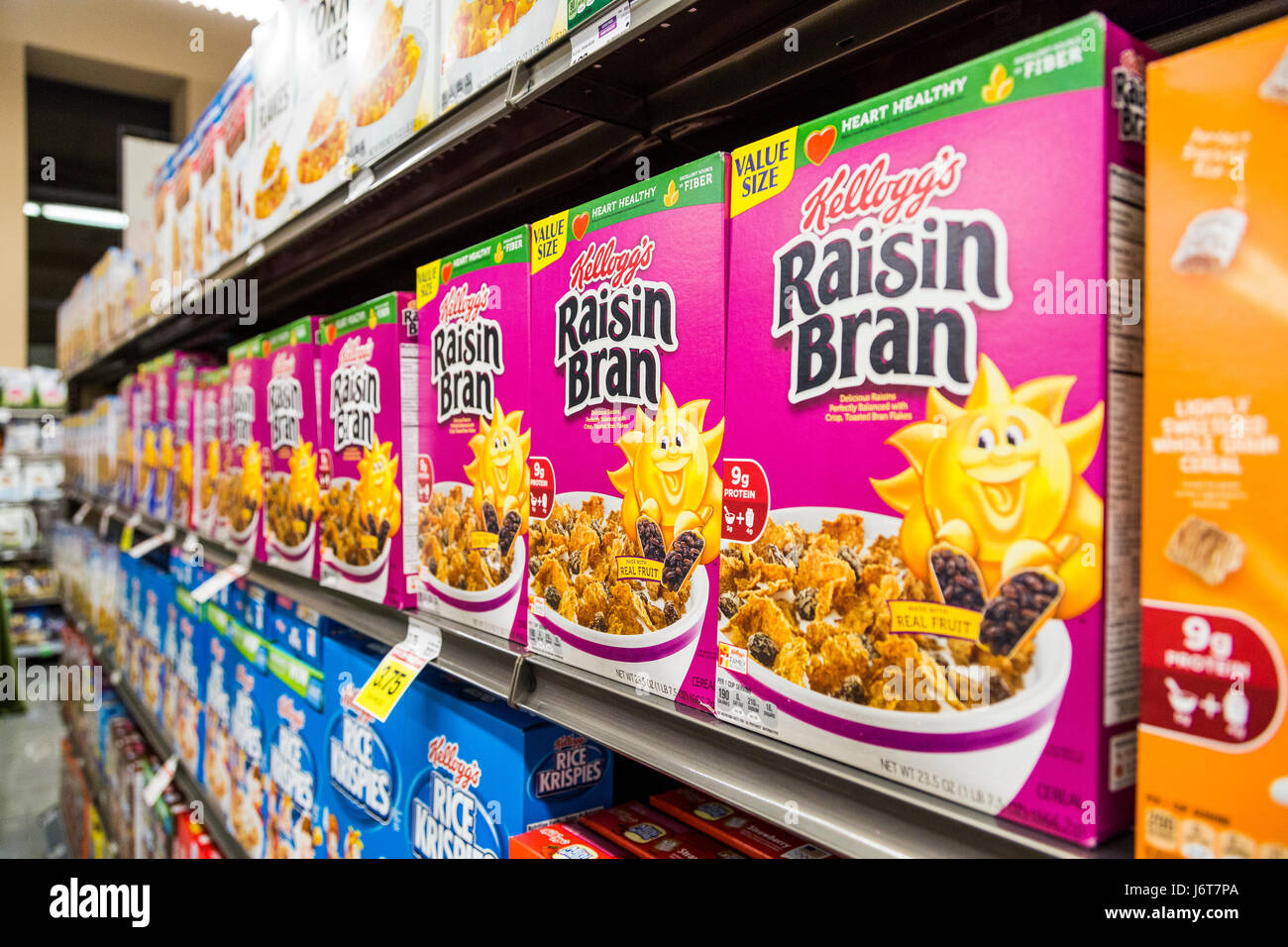 boxes of Raisin Bran cereal on a shelf at a grocery store Stock Photo