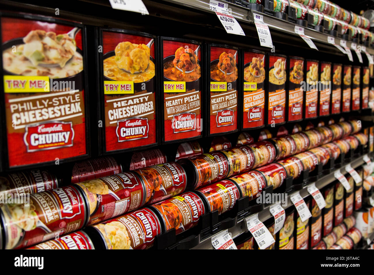 rows of Campbell's Chunky brand soup cans on the shelves of a grocery