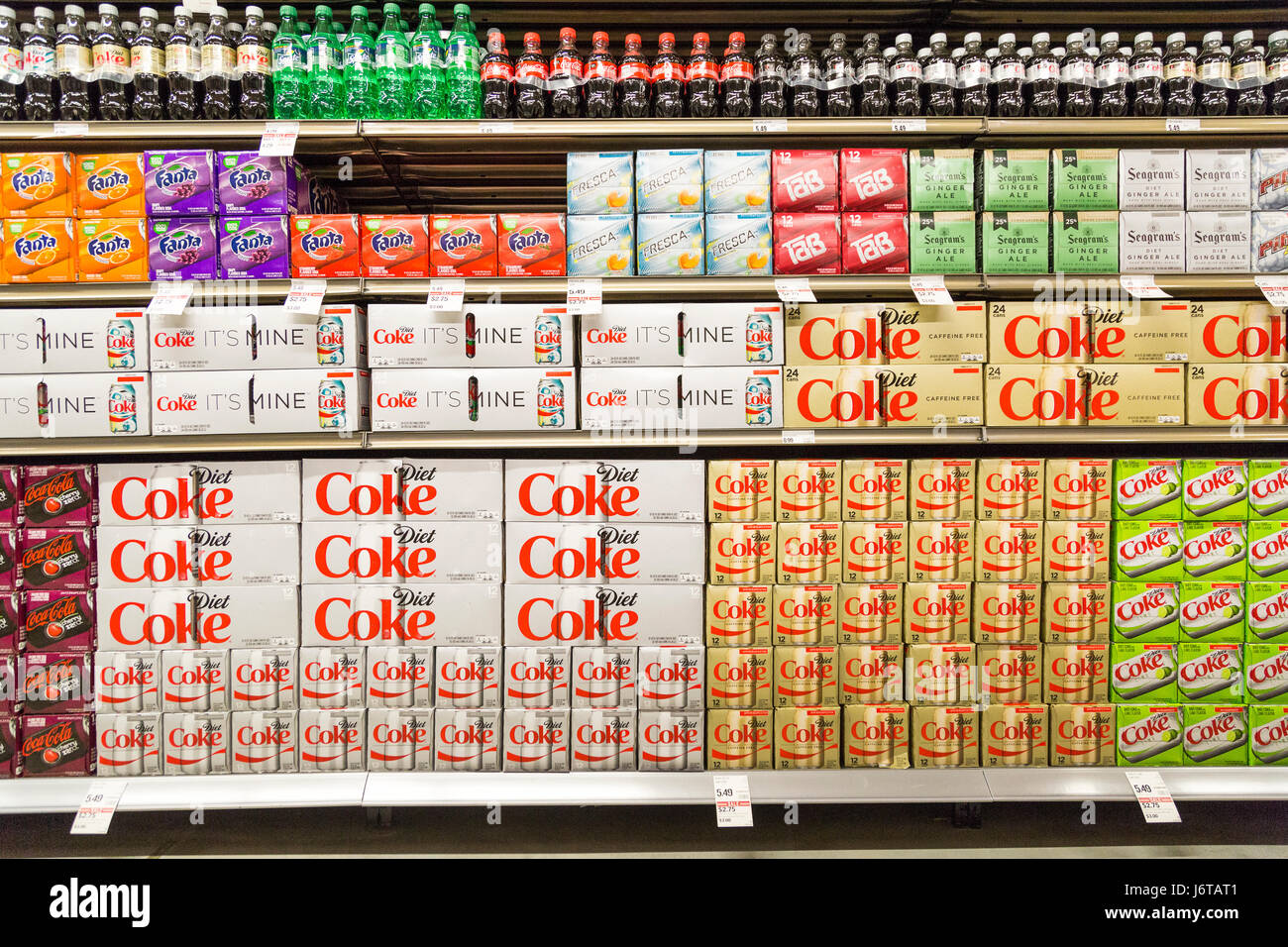 A large display of name brand soda on display for sale at a super market Stock Photo