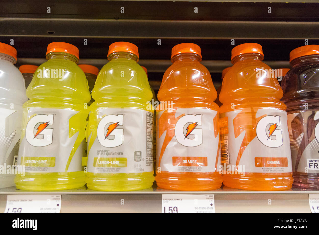 bottles of different flavored Gatorade for sale on the shelves of a