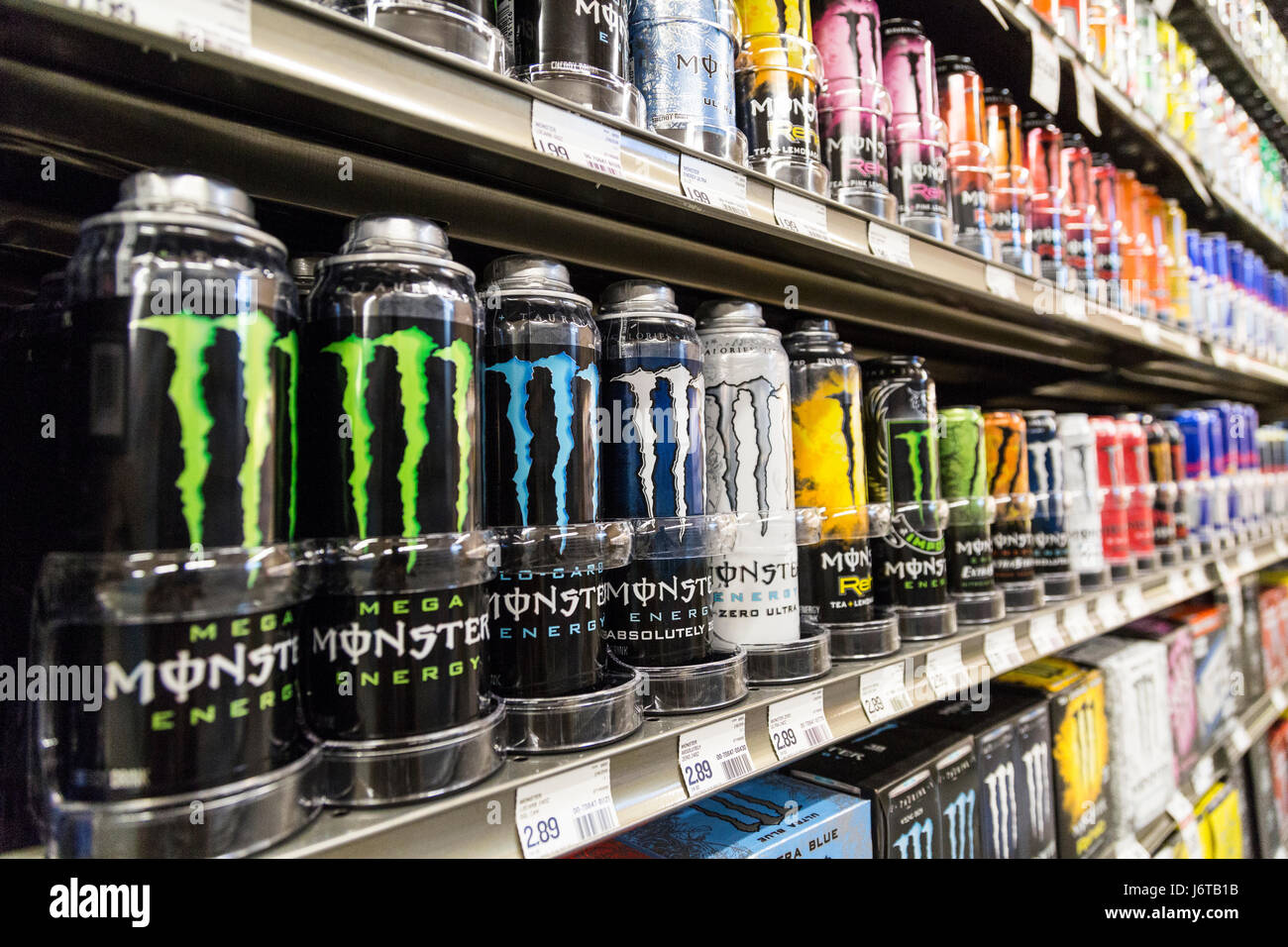 A display of Monster energy drinks cans on the shelves of a grocery store  Stock Photo - Alamy