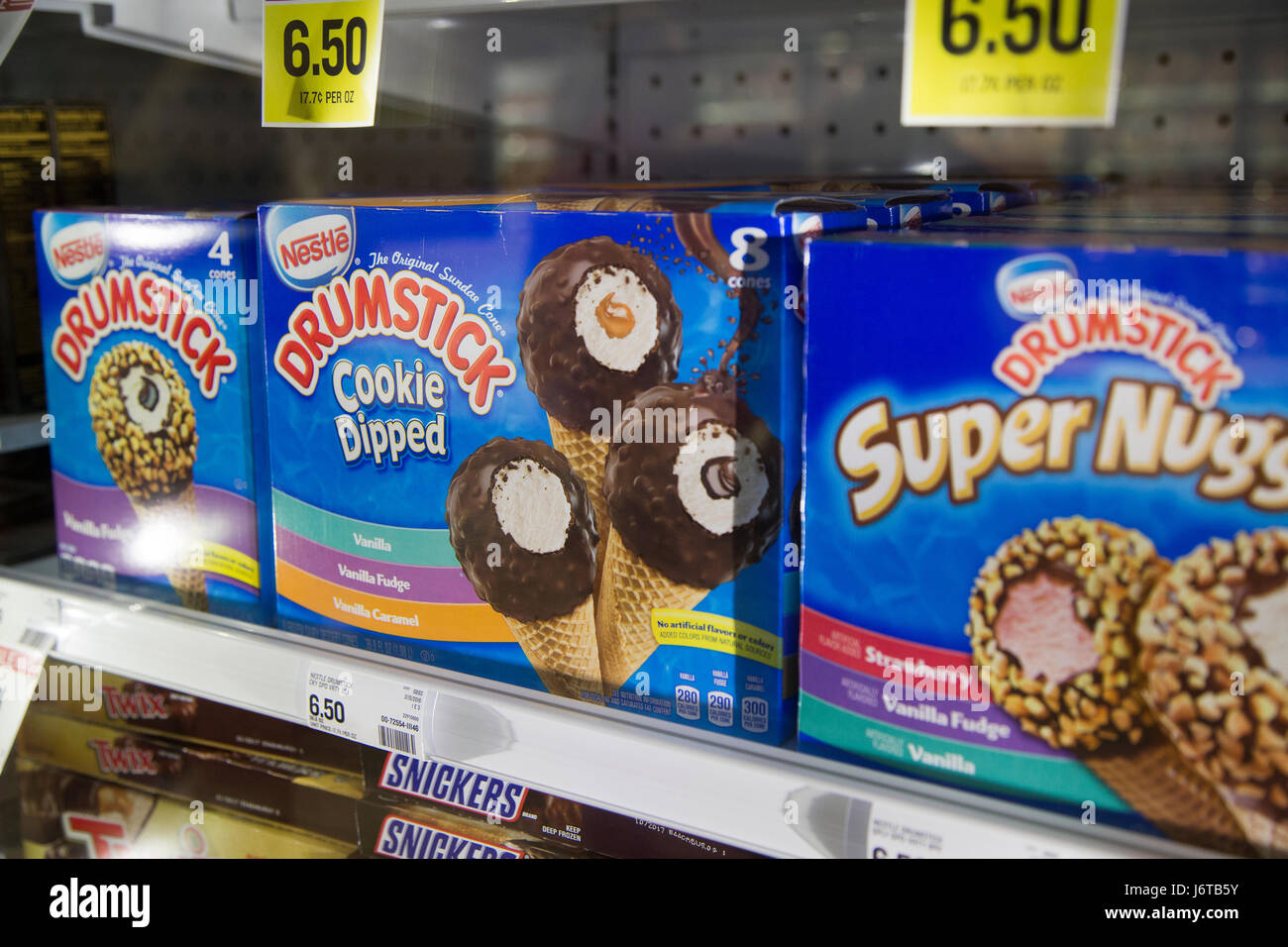 boxes of Drumstick frozen ice cream treats in the freezer case of a grocery store Stock Photo