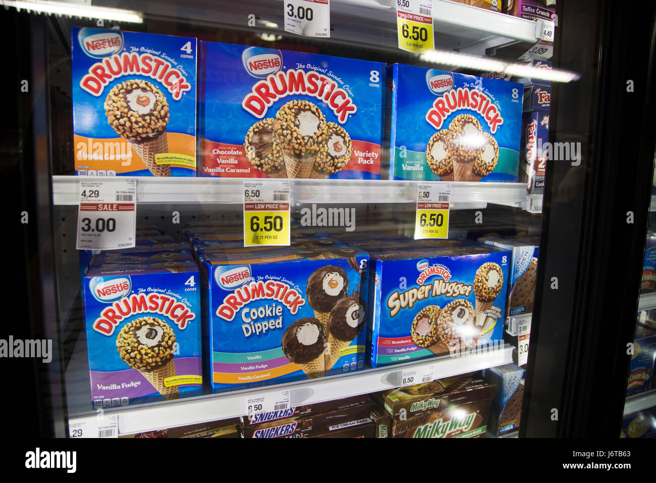 boxes of Drumstick frozen ice cream treats in the freezer case of a grocery store Stock Photo