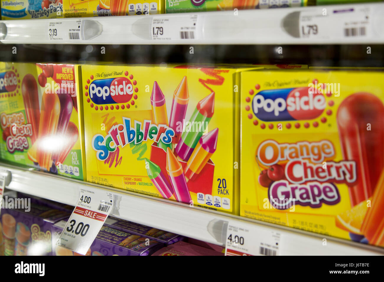 Popsicle brand boxes of popsicles in the freezer section of a grocery